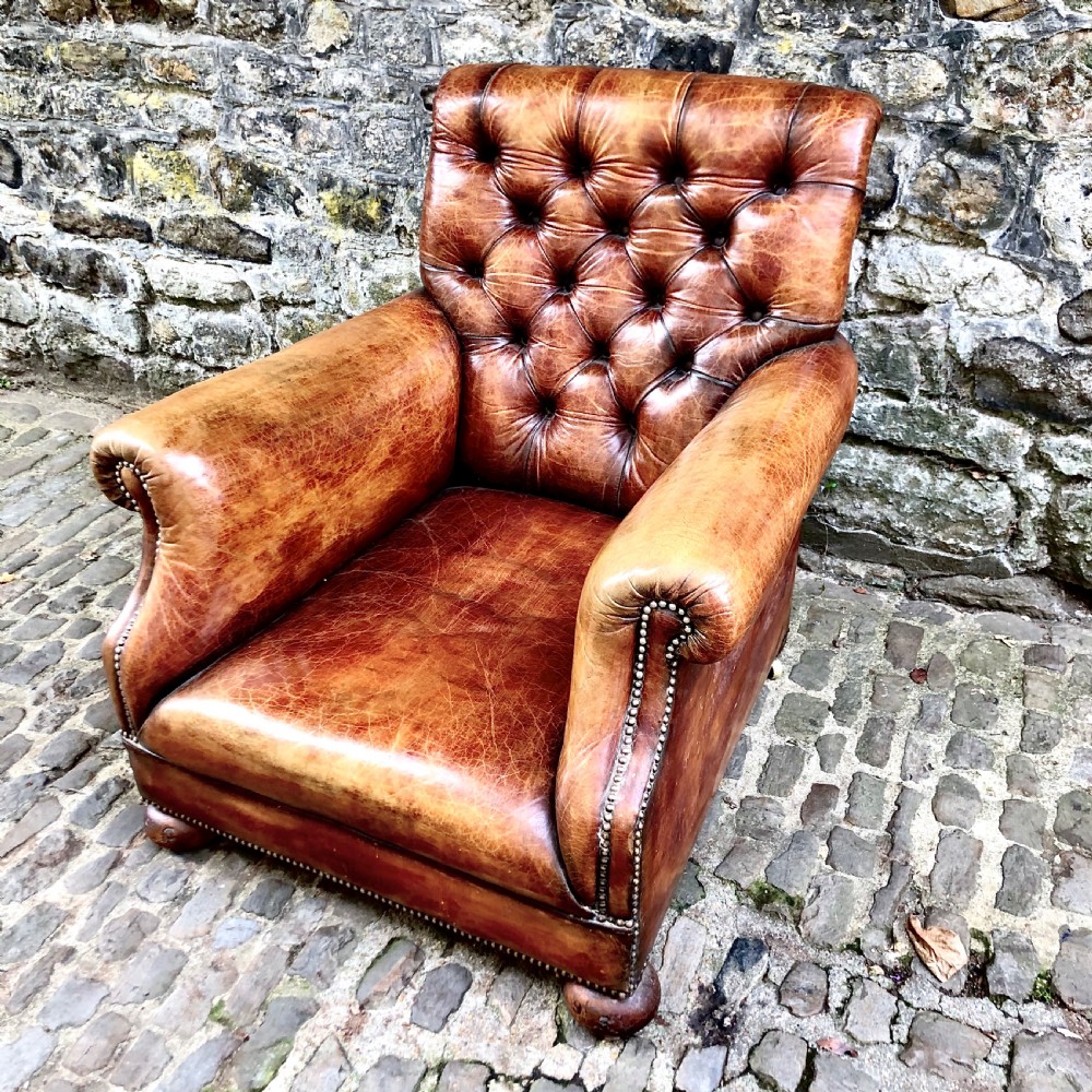 A late Victorian leather armchair  View V