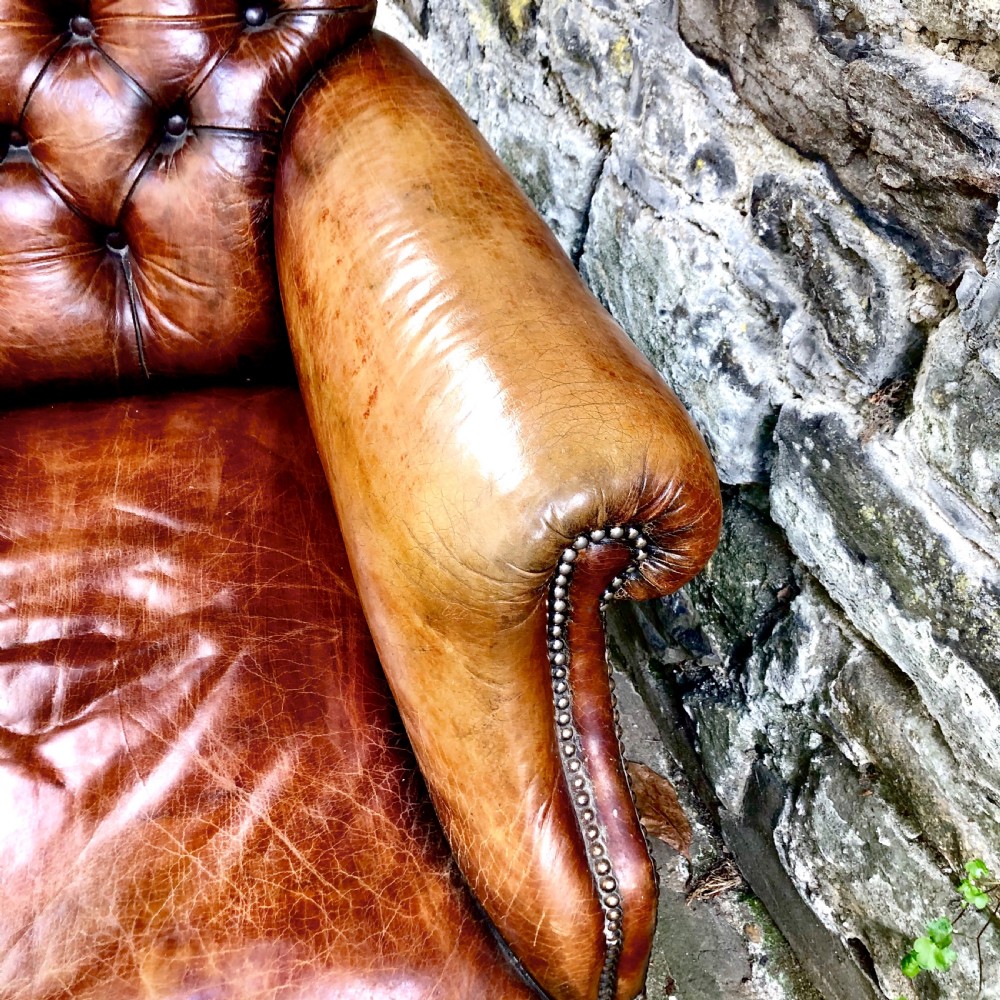 A late Victorian leather armchair  View VI