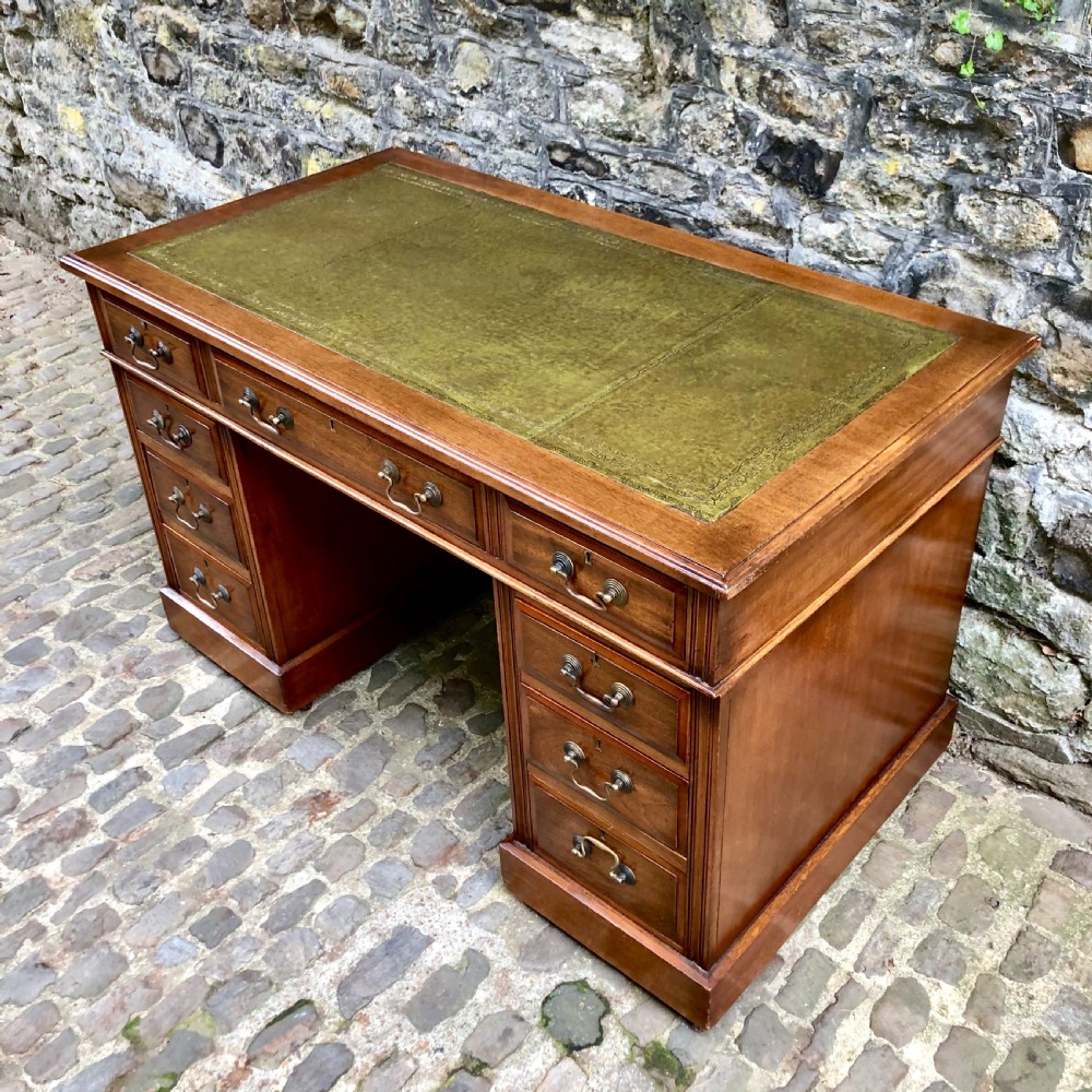 An Edwardian walnut pedestal desk  View II