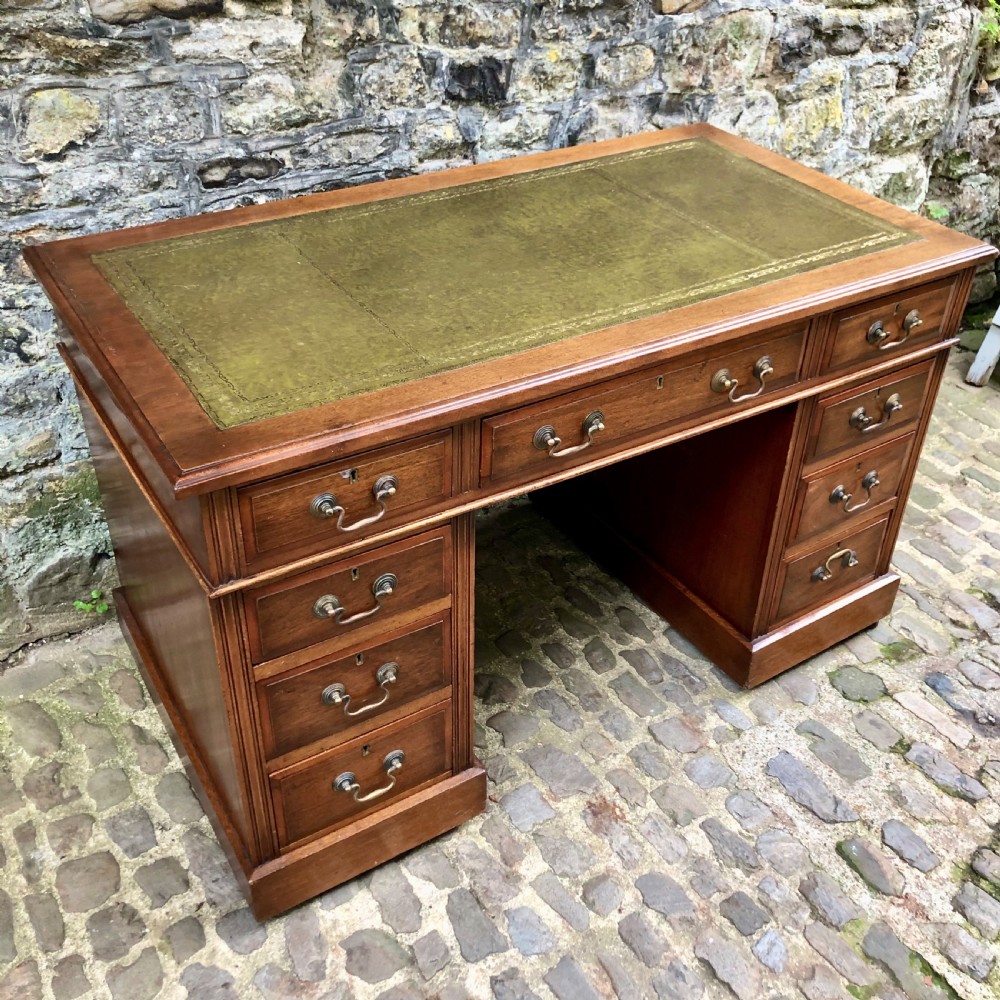 An Edwardian walnut pedestal desk  View III