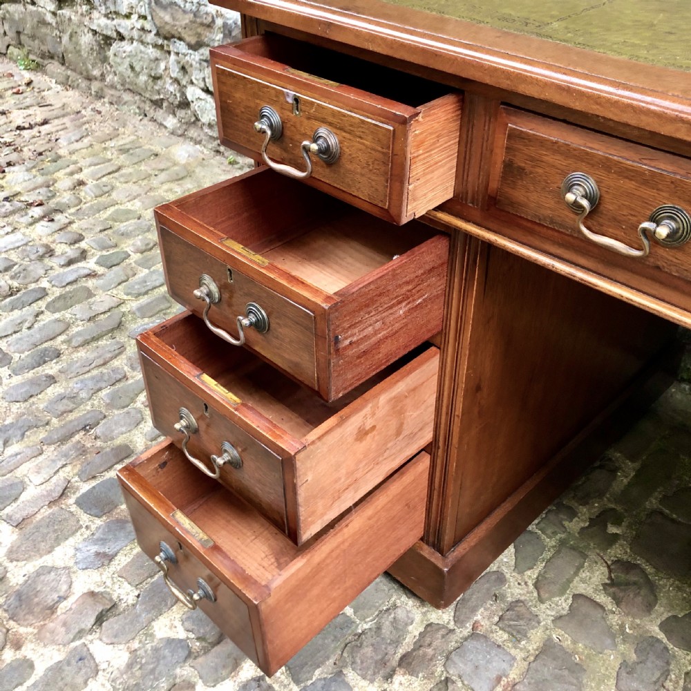 An Edwardian walnut pedestal desk  View IV