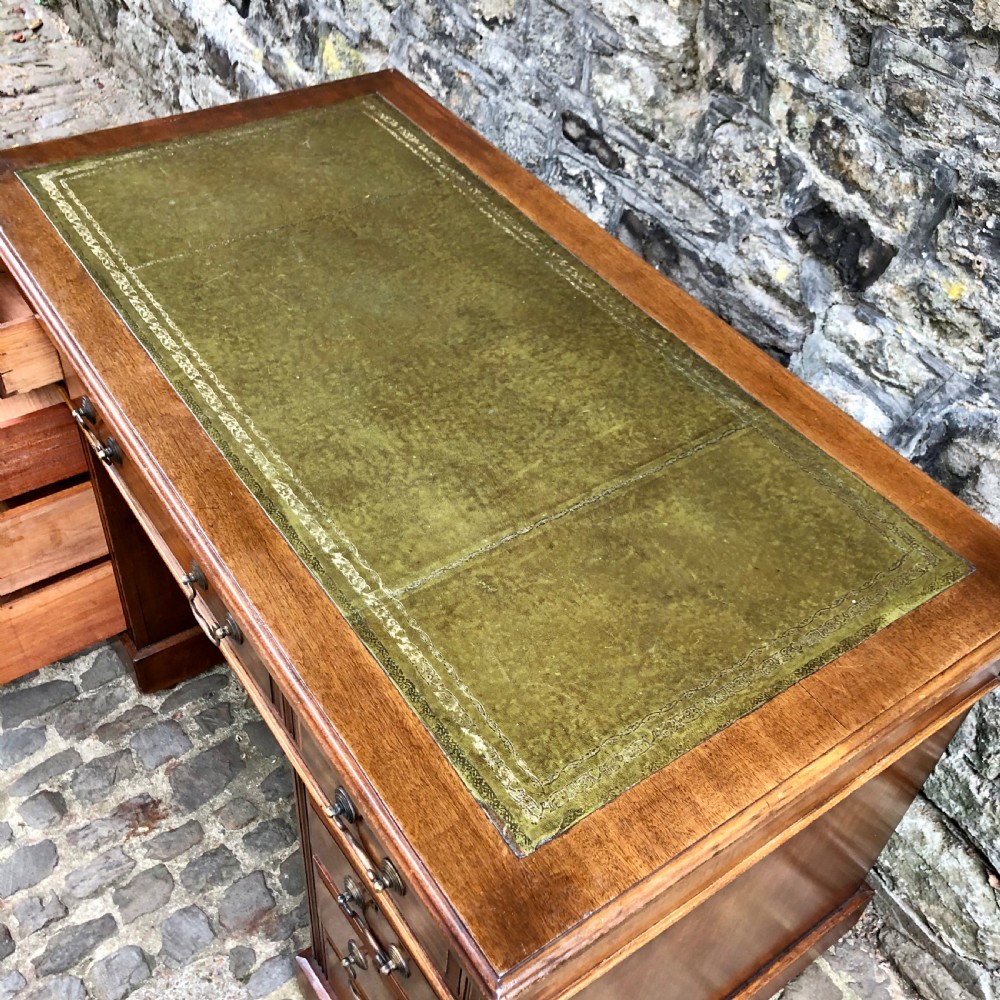 An Edwardian walnut pedestal desk  View V
