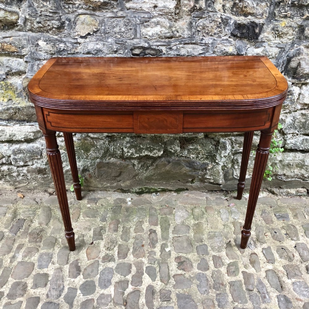 A George III mahogany card table 
