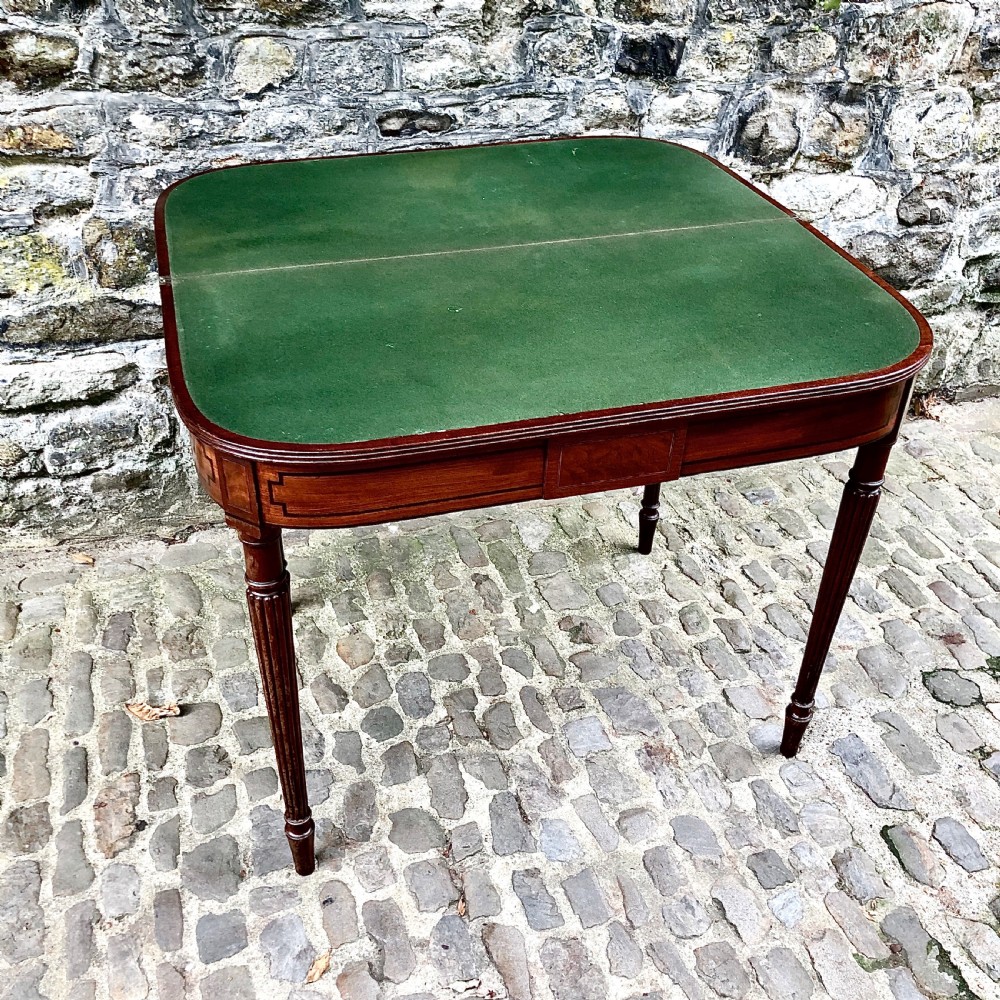 A George III mahogany card table  View V