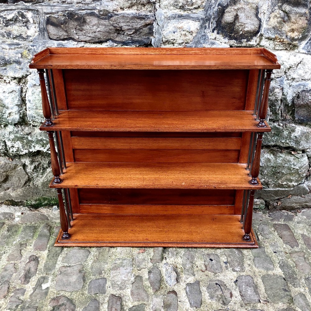 An early 19th century set of hanging shelves