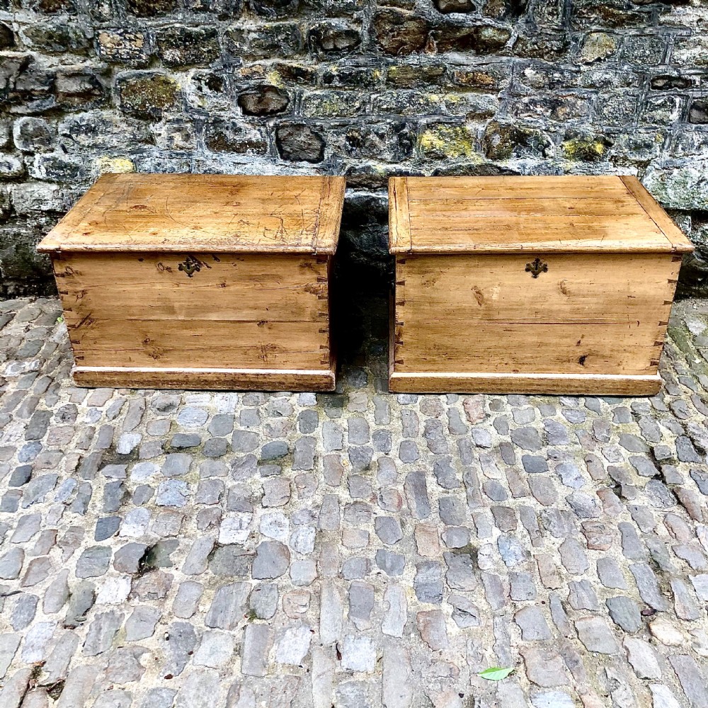 A pair of early 19th century pine blanket boxes or sailors trunks
