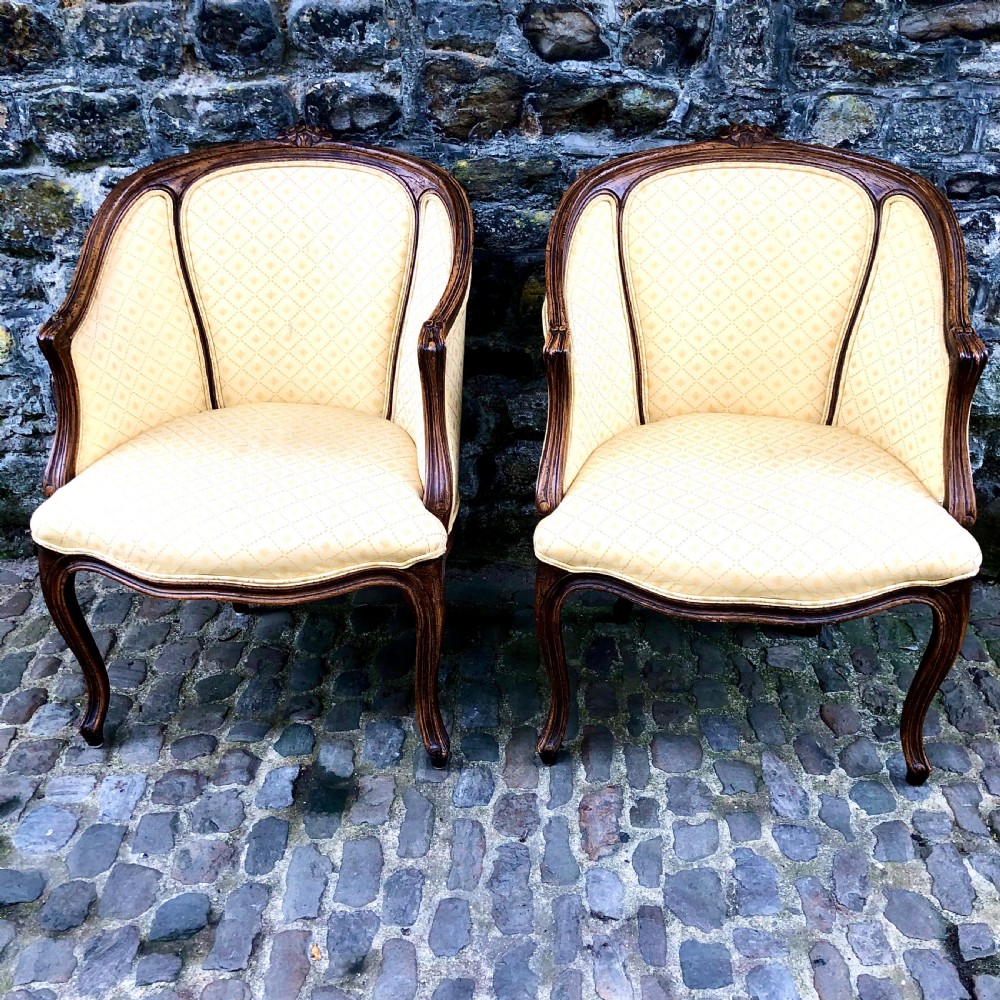 A pair of late 19th century French tub armchairs 