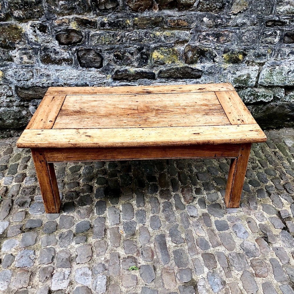 An early 20th century sycamore low or coffee table 