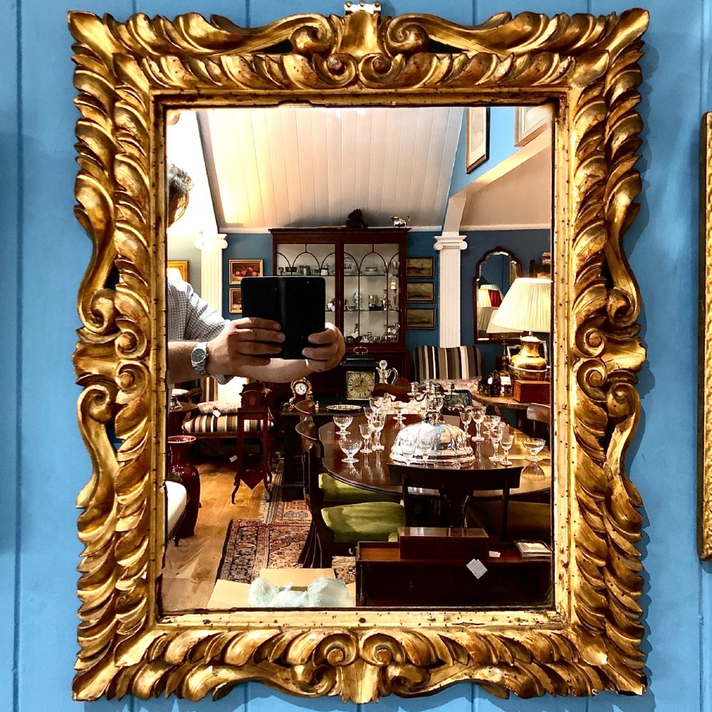 A mid 18th century Italian giltwood mirror 