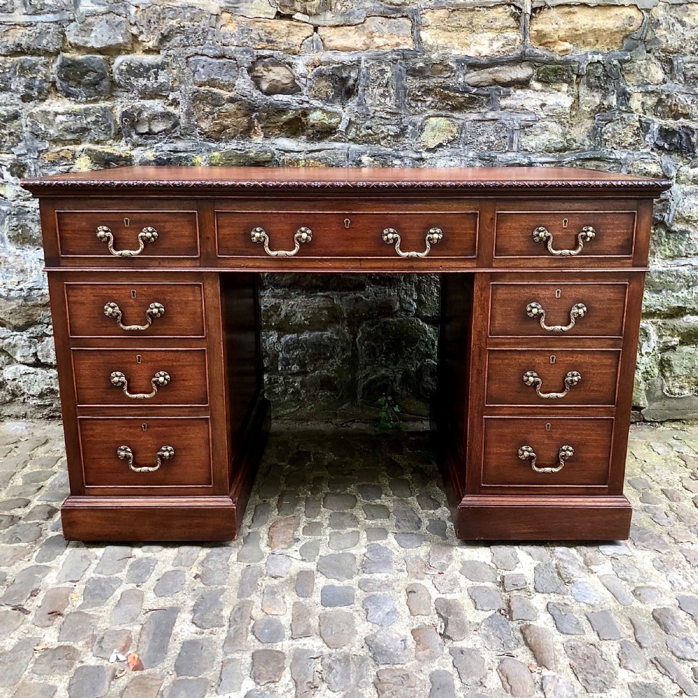An Edwardian mahogany pedestal desk 
