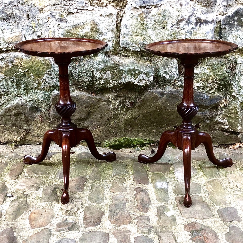 A pair of small Edwardian mahogany tripod wine tables 
