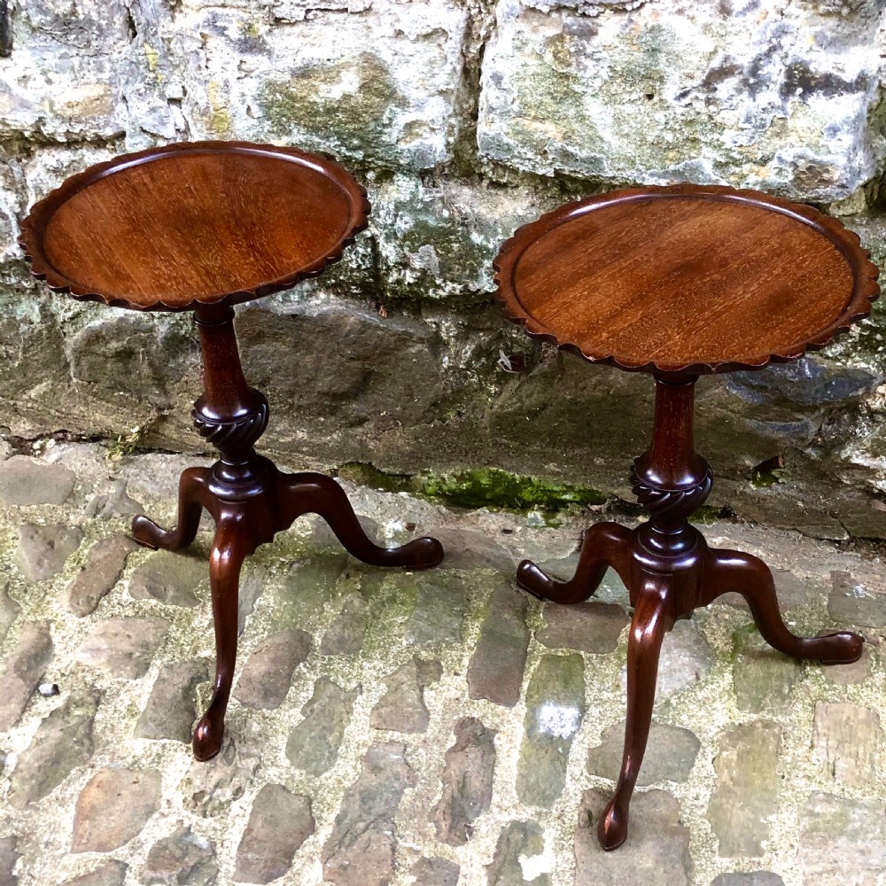 A pair of small Edwardian mahogany tripod wine tables  View III
