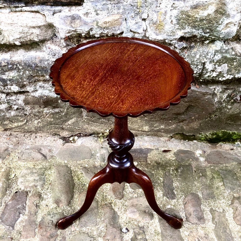 A pair of small Edwardian mahogany tripod wine tables  View V