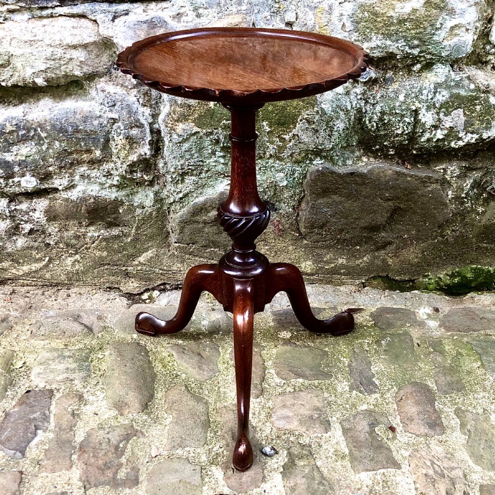 A pair of small Edwardian mahogany tripod wine tables  View VII