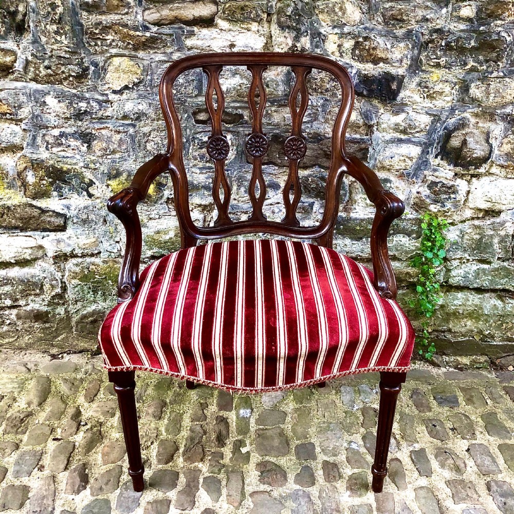 An Edwardian mahogany elbow or desk chair  View II
