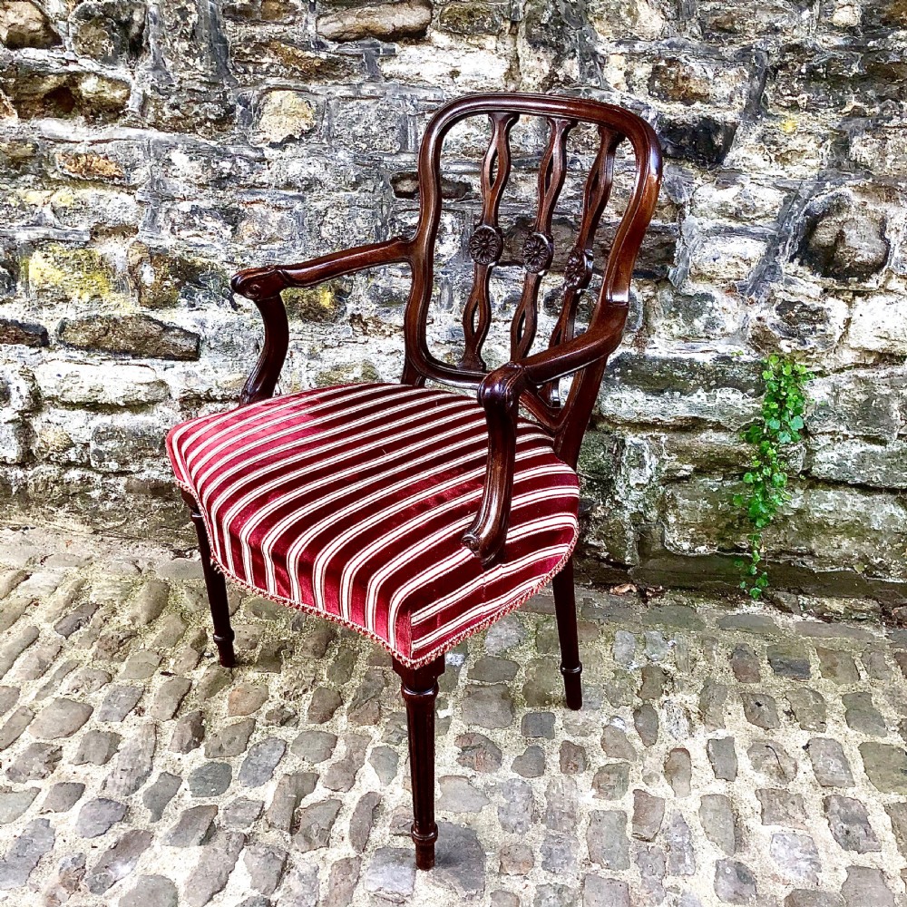 An Edwardian mahogany elbow or desk chair  View III