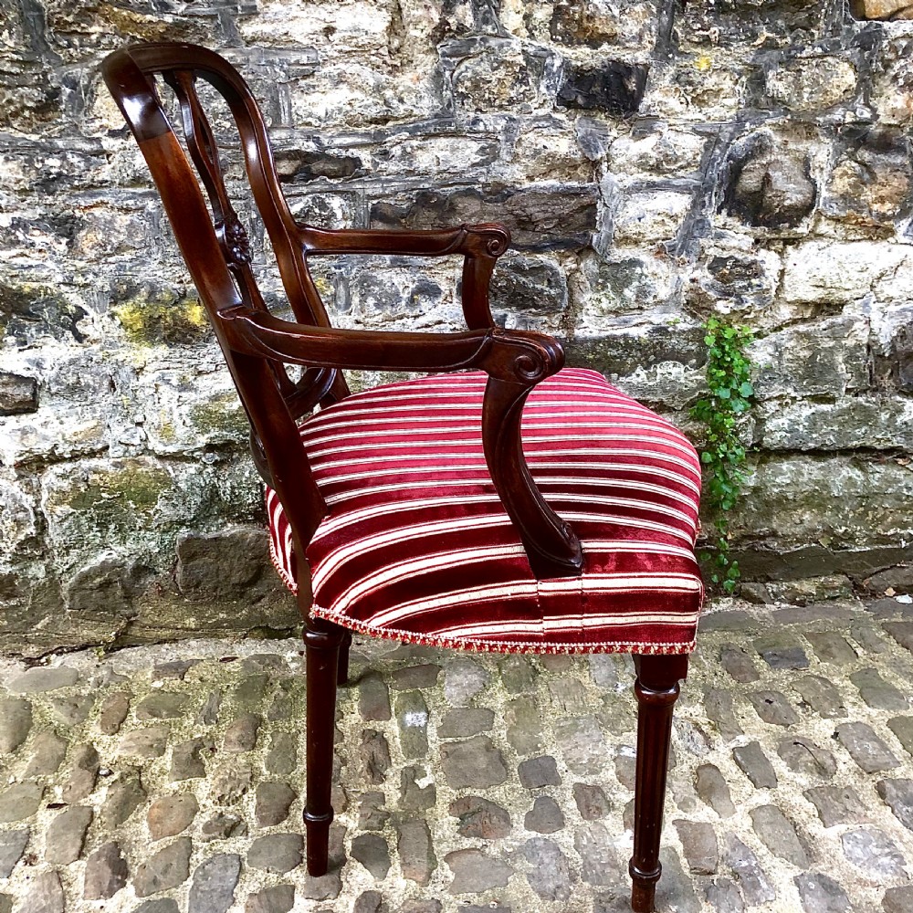 An Edwardian mahogany elbow or desk chair  View V