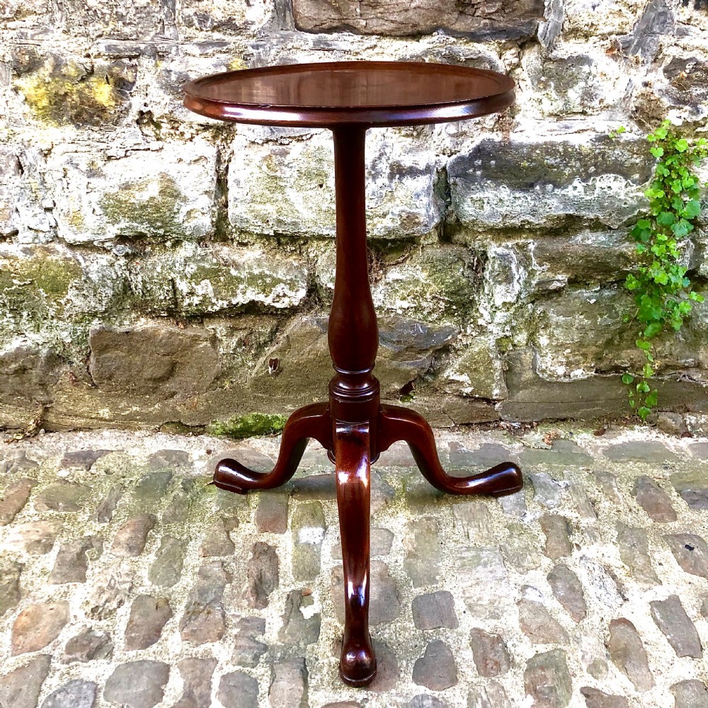 A mahogany tripod wine table in the George III style View II