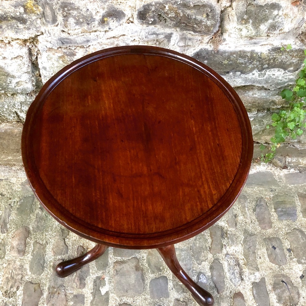 A mahogany tripod wine table in the George III style View III