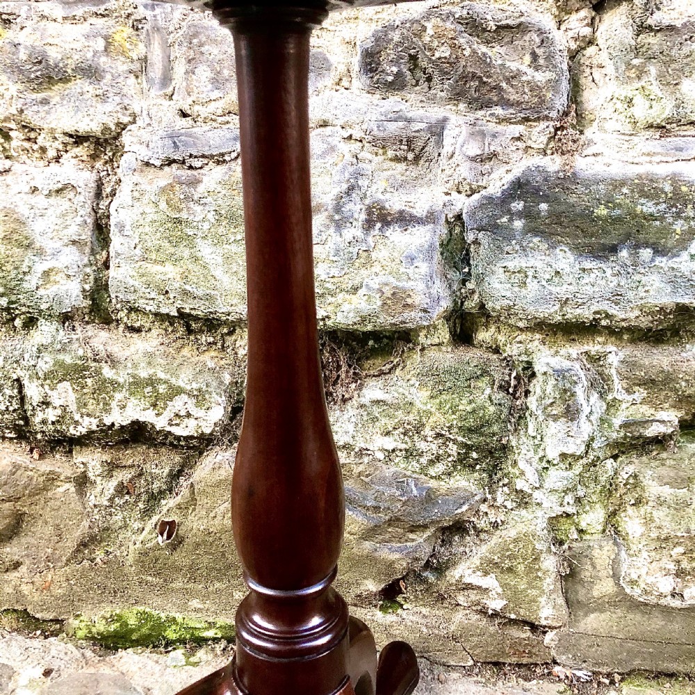 A mahogany tripod wine table in the George III style View V