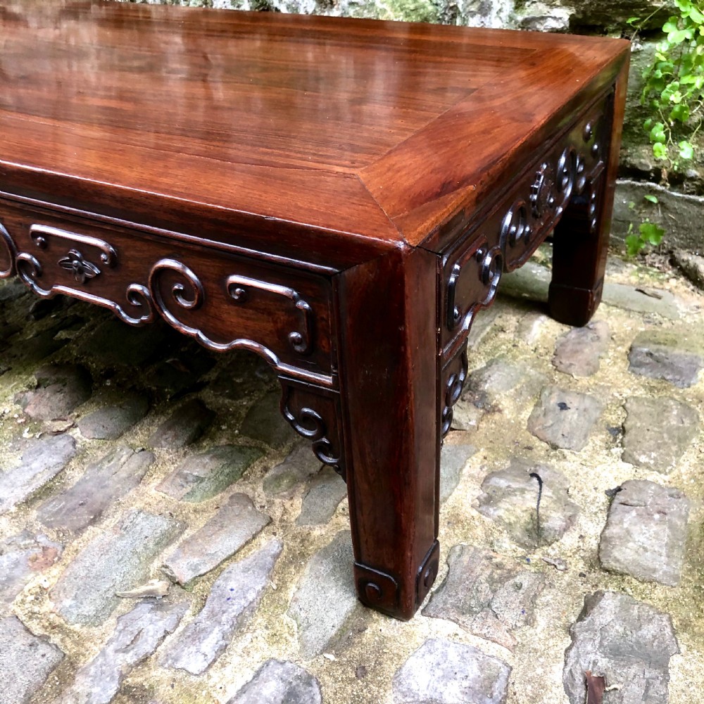 A 19th century Chinese rosewood low table or coffee table.  View VI