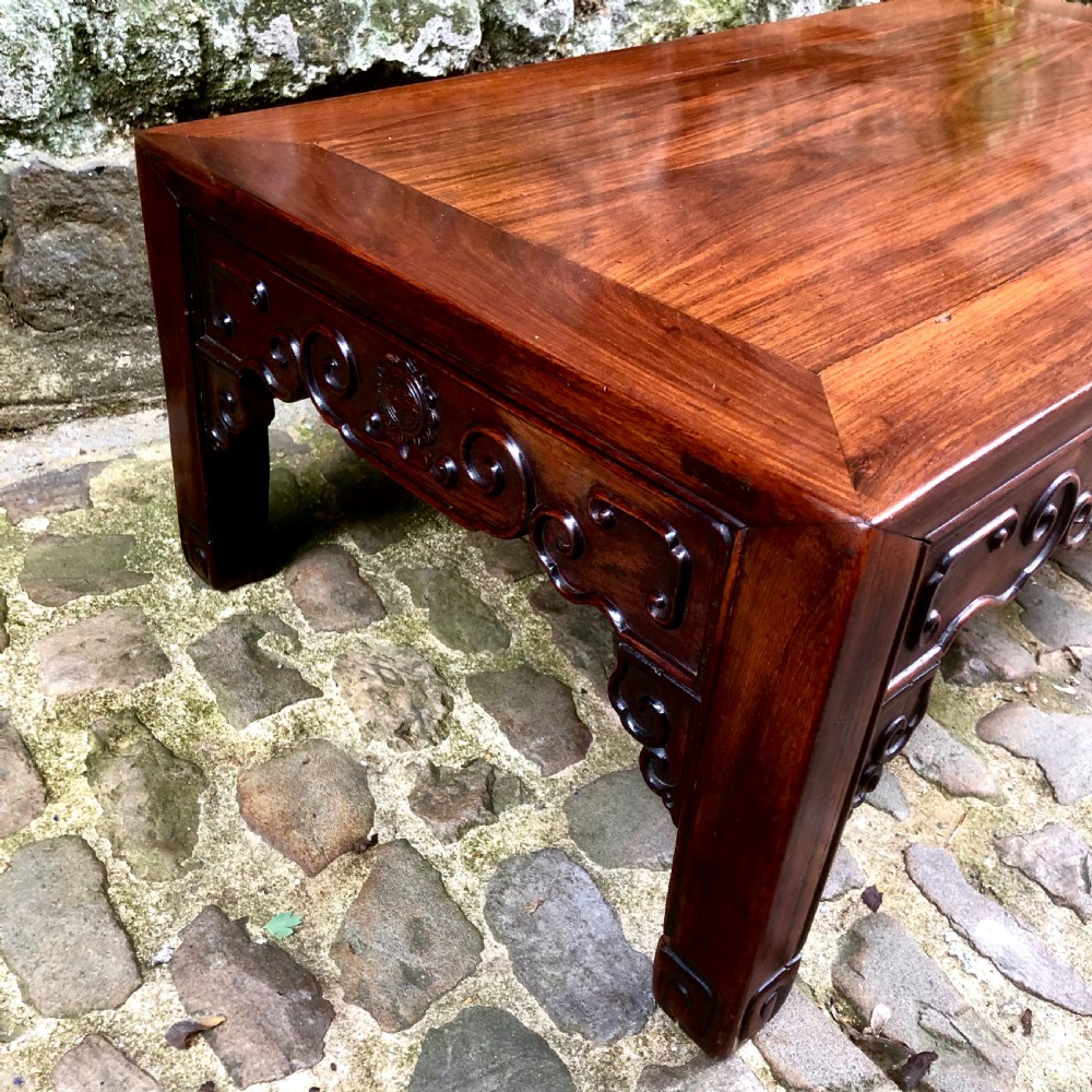A 19th century Chinese rosewood low table or coffee table.  View VII