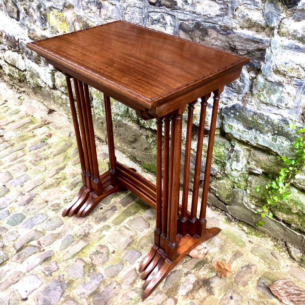 An Edwardian mahogany nest of four tables 