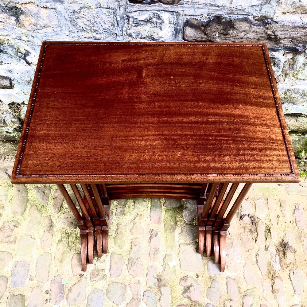 An Edwardian mahogany nest of four tables  View III