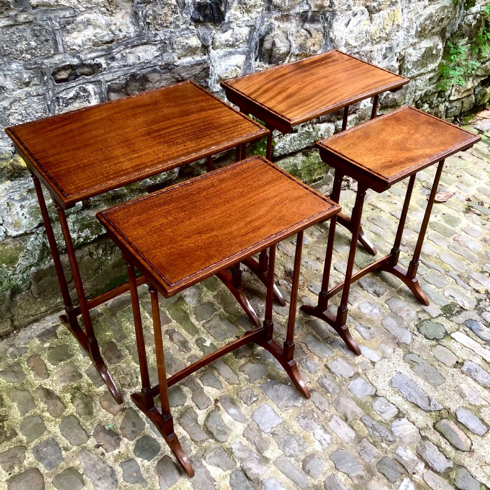 An Edwardian mahogany nest of four tables  View V