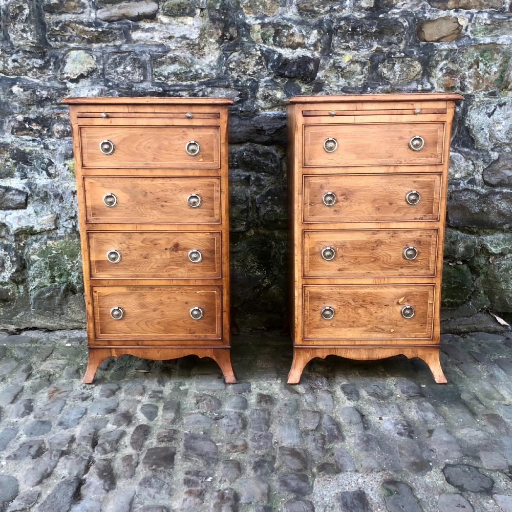 A pair of early 20th century yew wood bedside tables 