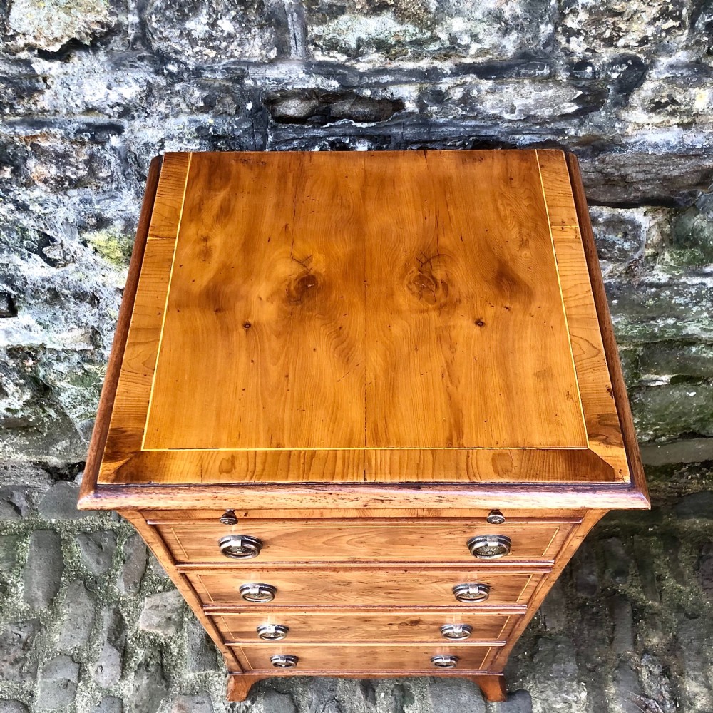 A pair of early 20th century yew wood bedside tables  View VI