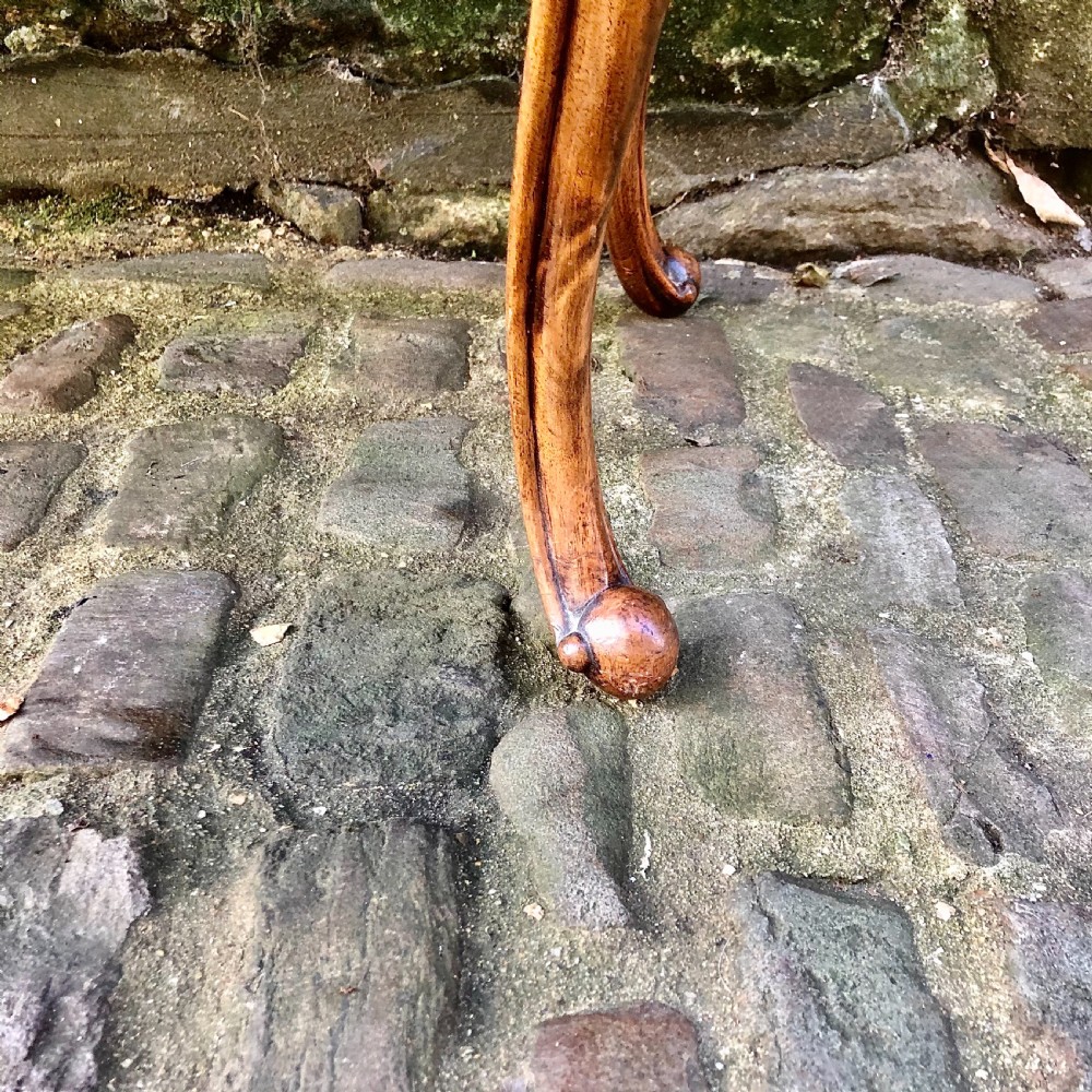 A mid Victorian walnut stool or window seat View V