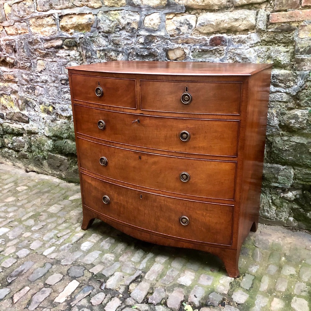 A Regency bowfront chest of drawers  View II