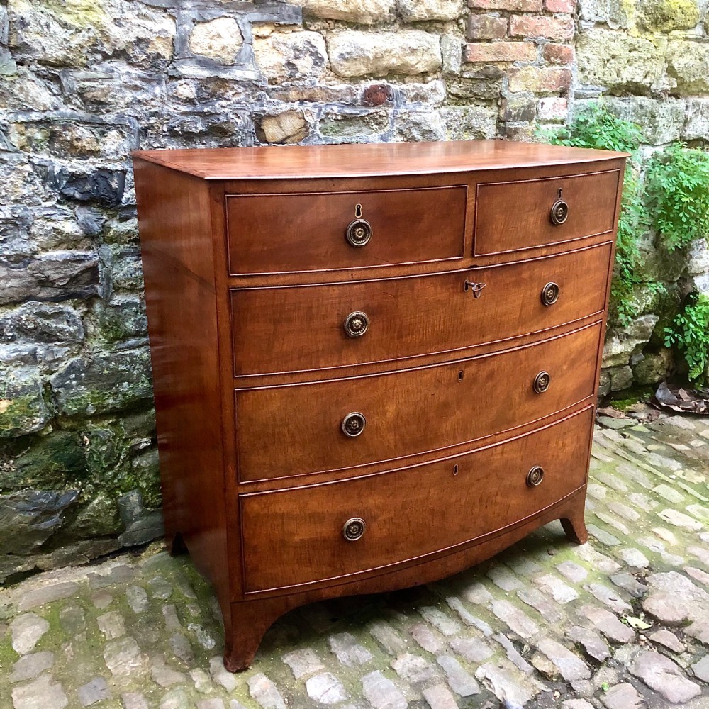 A Regency bowfront chest of drawers  View III