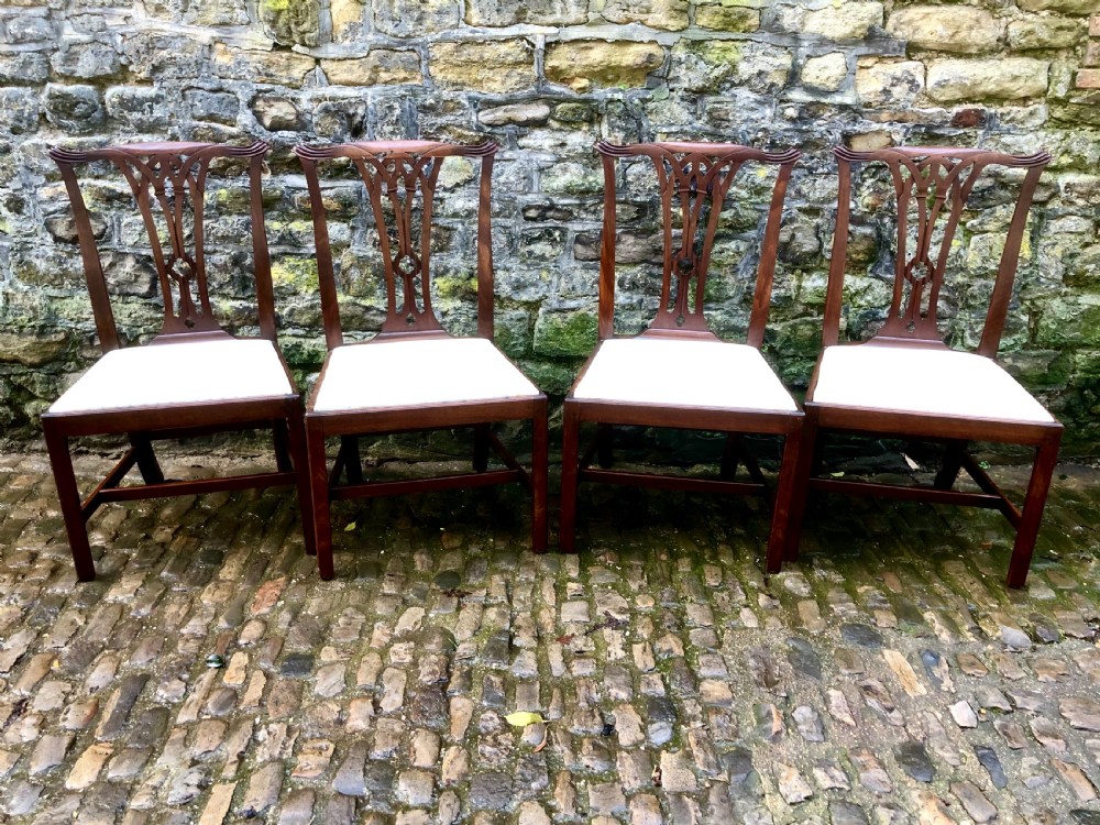 A set of four Georgian Chippendale mahogany dining chairs 