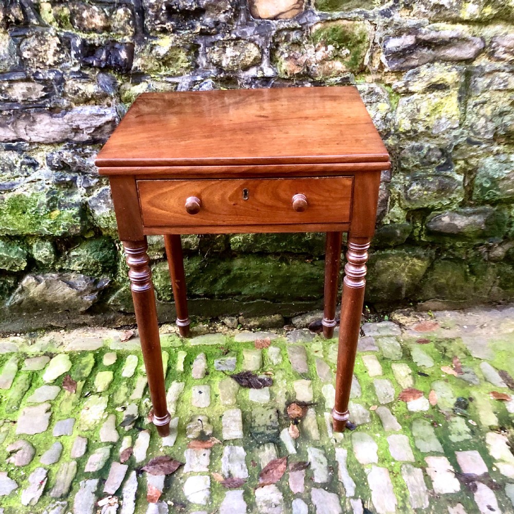 An early 19th century mahogany card table 