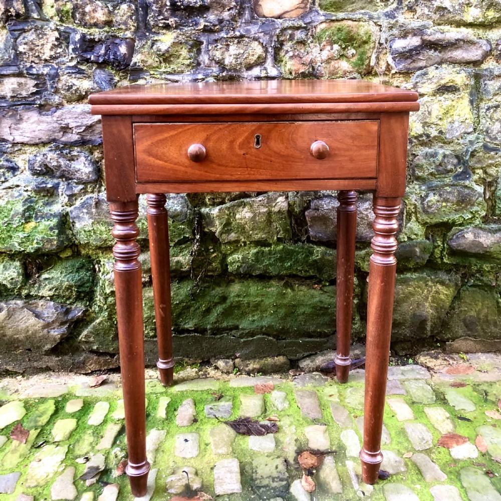 An early 19th century mahogany card table  View II