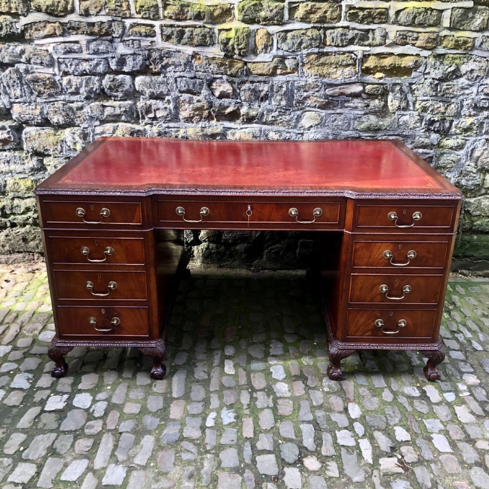 A large Edwardian freestanding mahogany pedestal desk 