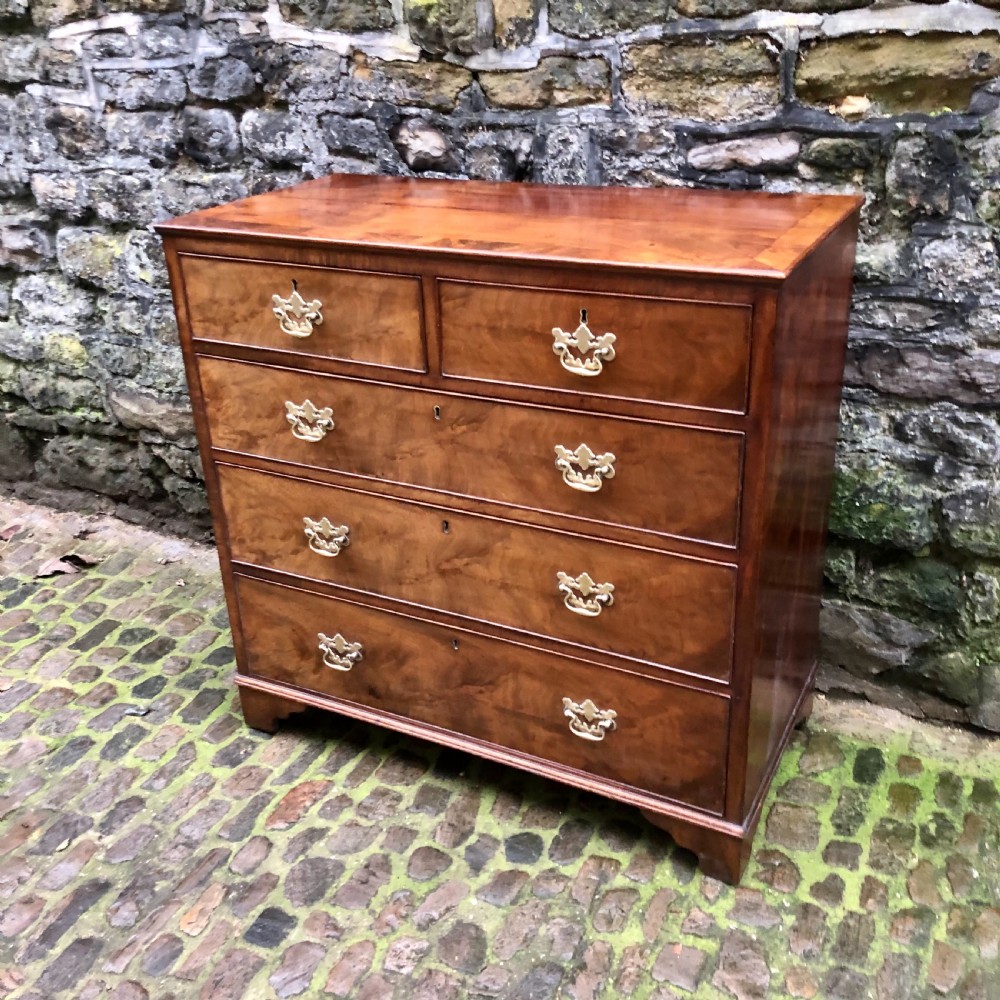 A George II walnut chest of drawers  View II