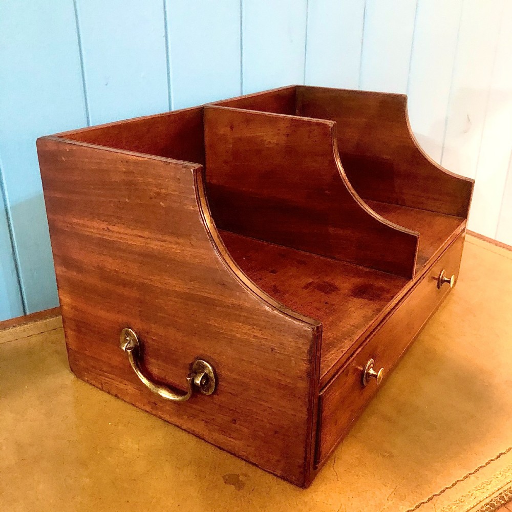 A George III mahogany book trough with two open divided compartments above a single drawer with two circular brass handles. View V