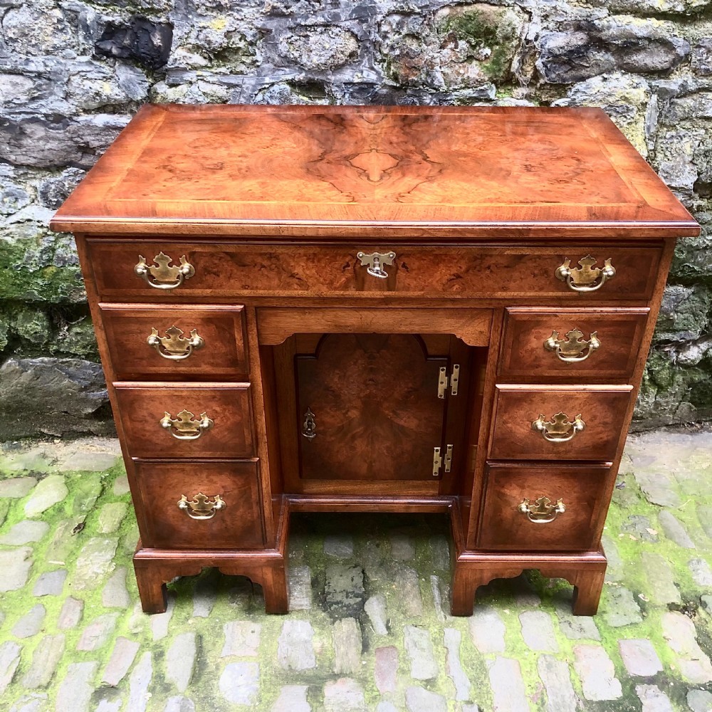 An early 20th century walnut kneehole desk View II