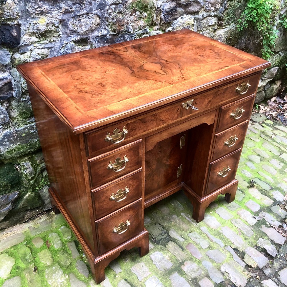 An early 20th century walnut kneehole desk View III