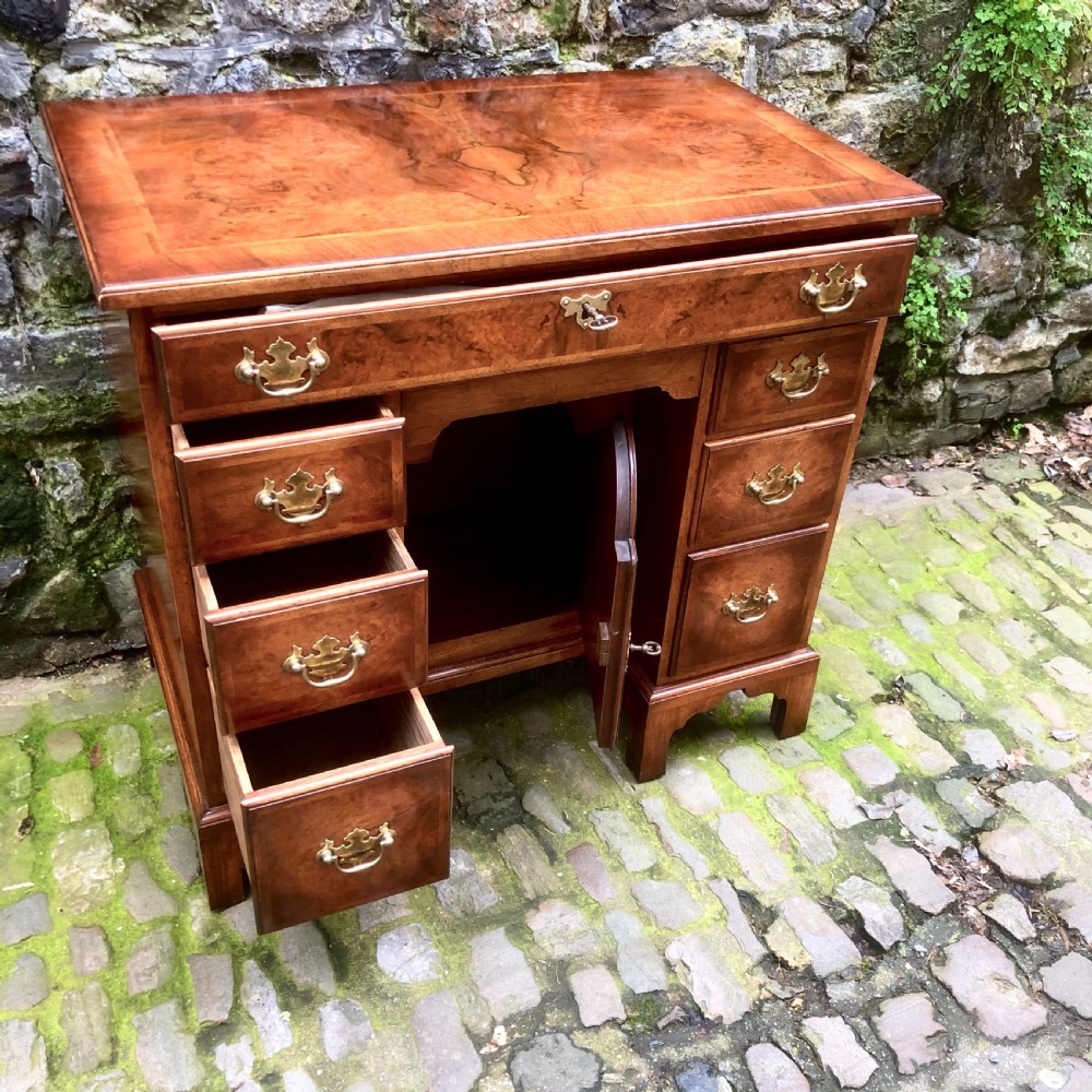 An early 20th century walnut kneehole desk View VI