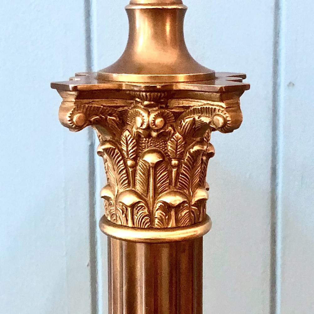 An early twentieth-century brass table lamp shaped as a fluted Corinthian column on a square stepped base. View IV