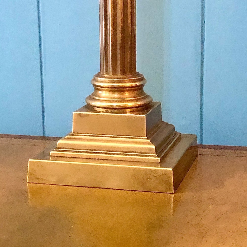 An early twentieth-century brass table lamp shaped as a fluted Corinthian column on a square stepped base. View V