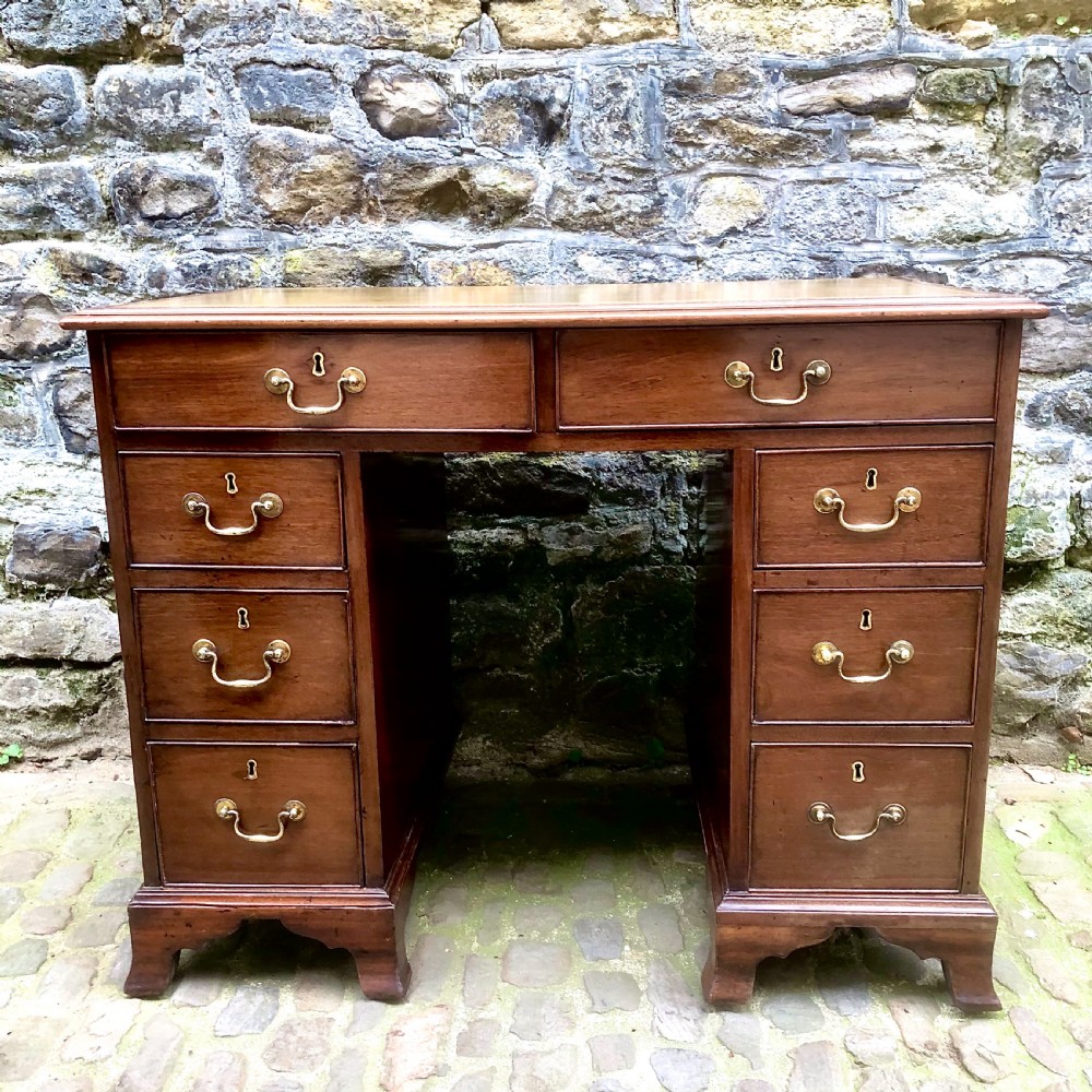 A small mid Victorian mahogany kneehole desk 