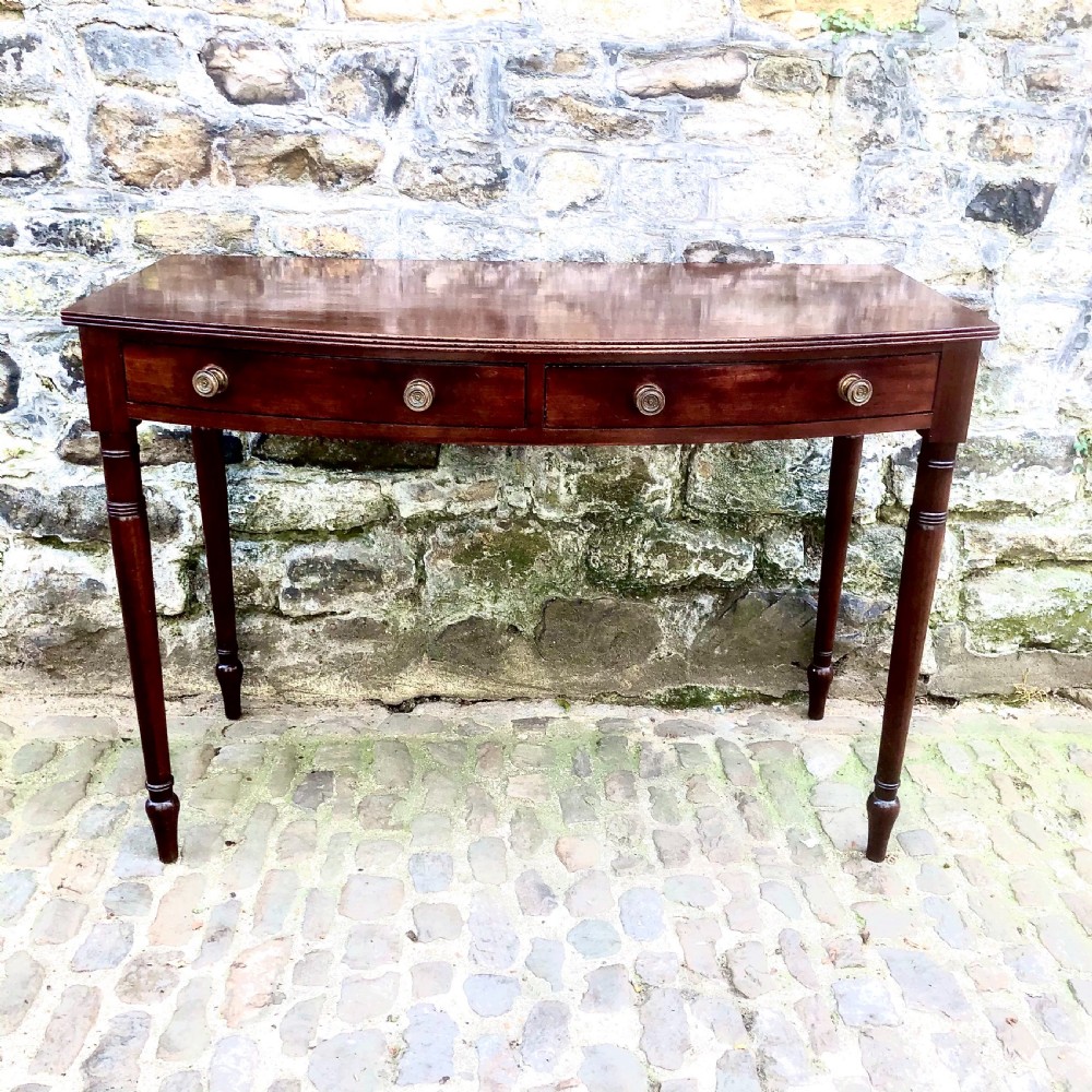 A George III mahogany bowfront side table