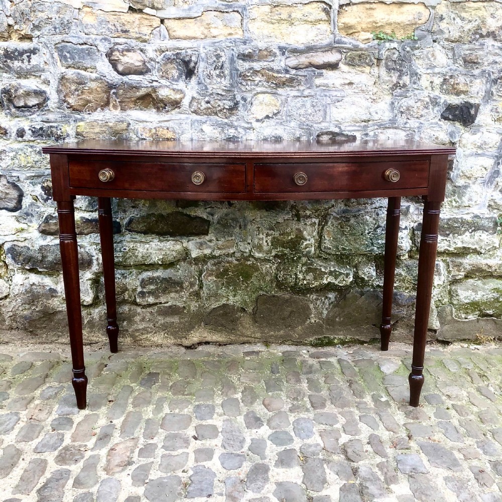 A George III mahogany bowfront side table View II