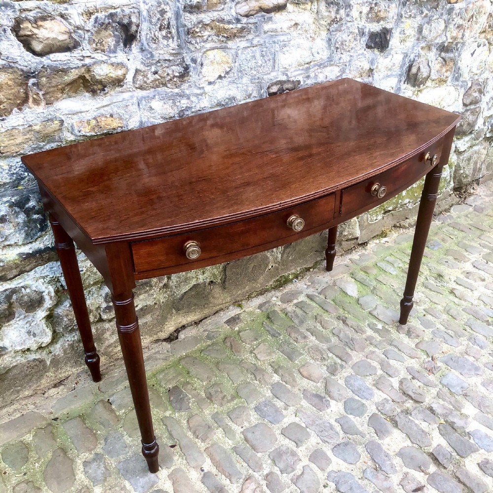 A George III mahogany bowfront side table View IV