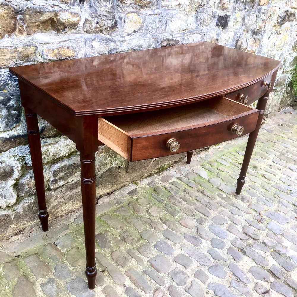 A George III mahogany bowfront side table View V